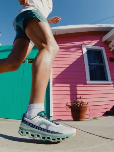 Man running in the On Cloudmonster running shoes