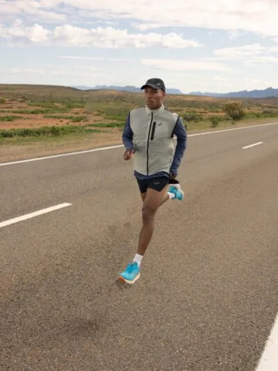 Asics Nimbus 25 man running on road