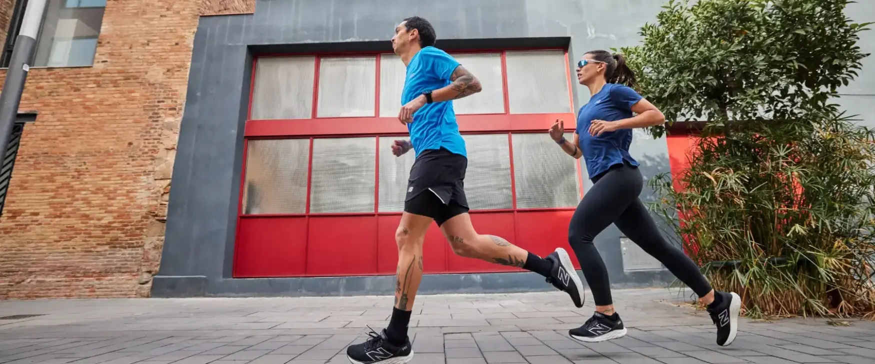 Man and woman running in New Balance running shoes