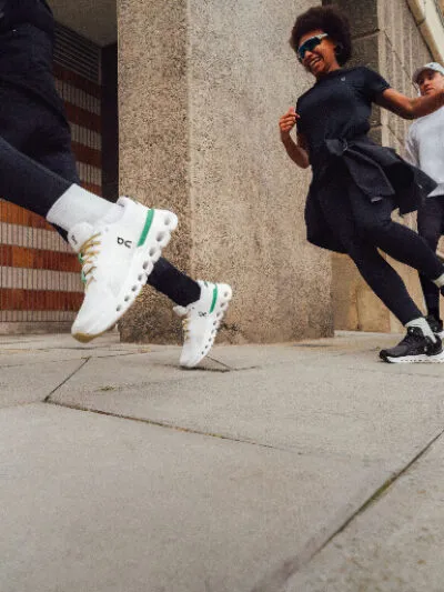 People running on the street with on cloudrunner 2