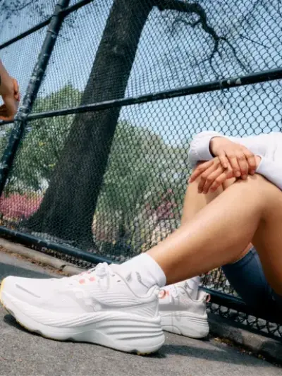 Two women wearing saucony running shoes