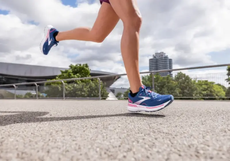 Woman running in Brooks Adrenaline stability running shoes