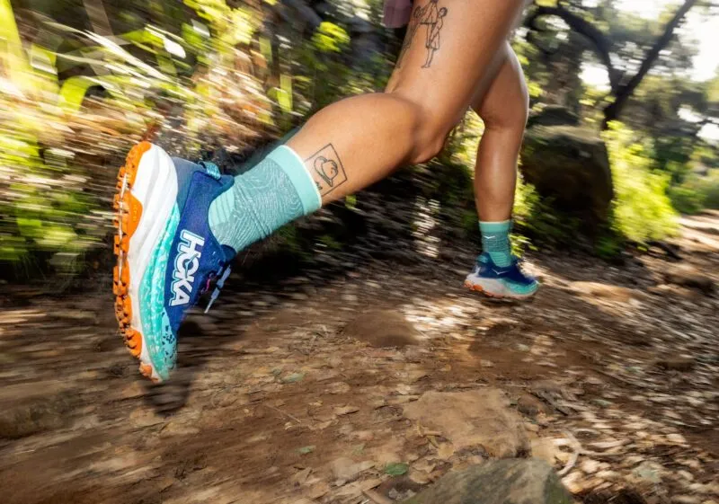 HOKA Speedgoat 6 lifestyle runner on trail womens