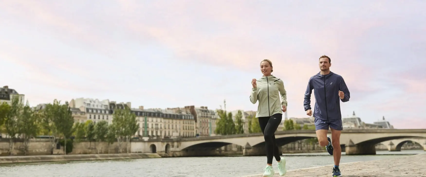 Man and woman running in a pair of Asics running shoes (1)