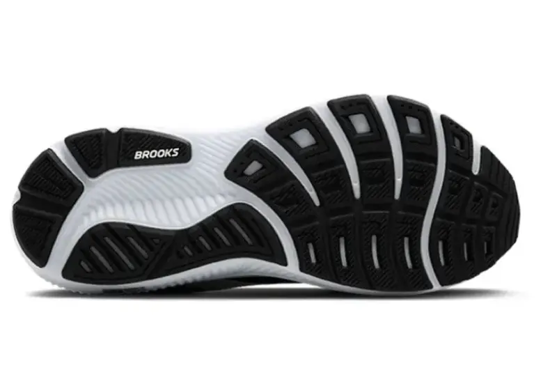 Bottom view of the Brooks Ghost 17 outsole, featuring a black and white segmented rubber tread designed for flexibility and traction.