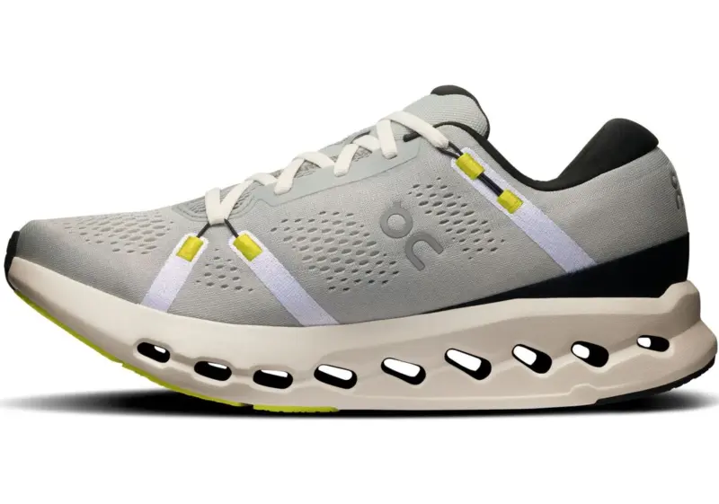 On Running Cloudsurfer 2 running shoe in Glacier/Ivory colorway, featuring a breathable mesh upper, distinctive white and yellow lace loops, and a uniquely cushioned midsole with cut-out pods for impact absorption and energy return.