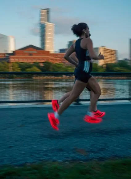 people running in adidas adios pro 5